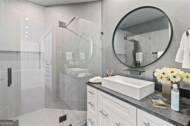 8610 Sentinae Chase Dr, Roswell, GA 30076 - bathroom with vanity, tile walls, and a stall shower