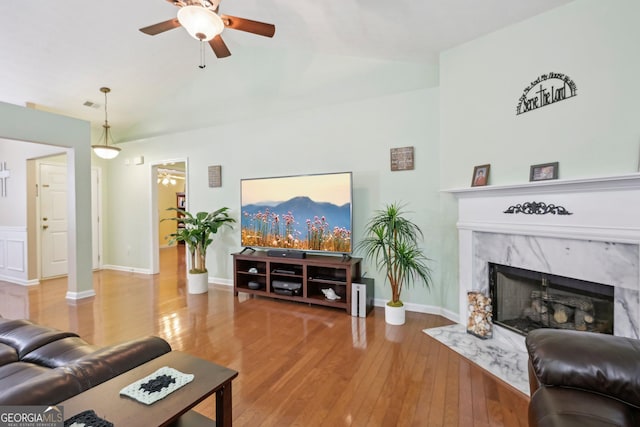 198 Lake Cv, Approach, Newnan, GA 30265 - living room featuring ceiling fan, a fireplace, wood-type flooring, lofted ceiling, and baseboards