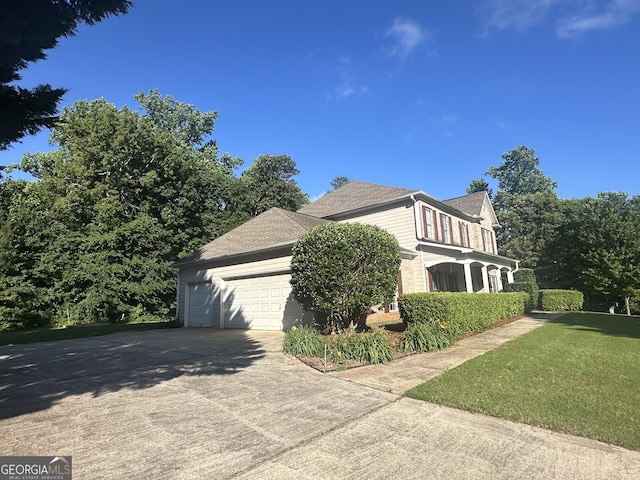 311 Arbor Point Ct SW, Lilburn, GA 30047 - view of side of property with concrete driveway and a garage
