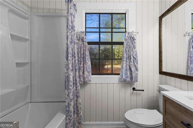 374 Dooley Rd, Dallas, GA 30132 - bathroom with vanity, shower / bath combo with shower curtain, toilet, and wood walls