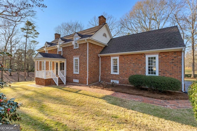 135 Mill Race Rd, Thomaston, GA 30286 - back of property with brick siding, a lawn, a chimney, and a shingled roof