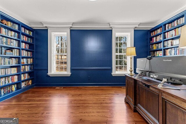 135 Mill Race Rd, Thomaston, GA 30286 - office featuring wood finished floors, built in features, bookshelves, and ornamental molding