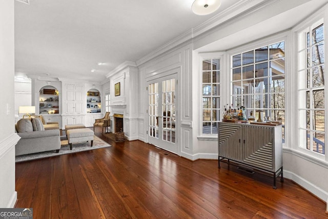 135 Mill Race Rd, Thomaston, GA 30286 - living room featuring hardwood / wood-style floors, plenty of natural light, ornamental molding, and a fireplace
