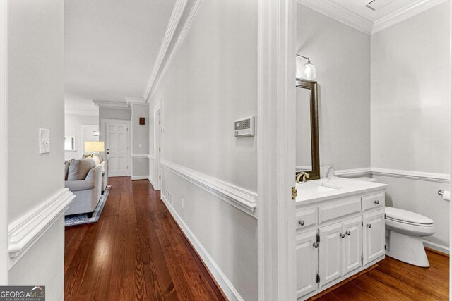 135 Mill Race Rd, Thomaston, GA 30286 - hall featuring a sink, dark wood finished floors, and ornamental molding