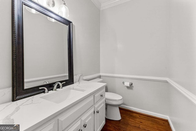 135 Mill Race Rd, Thomaston, GA 30286 - bathroom with ornamental molding, vanity, toilet, wood finished floors, and baseboards