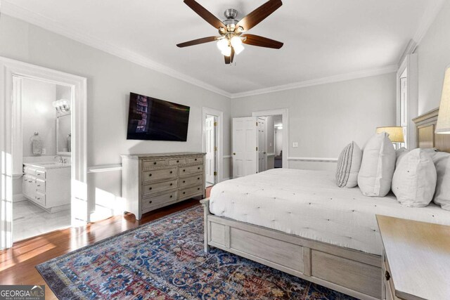 135 Mill Race Rd, Thomaston, GA 30286 - bedroom with ornamental molding, wood finished floors, a sink, ensuite bathroom, and a ceiling fan