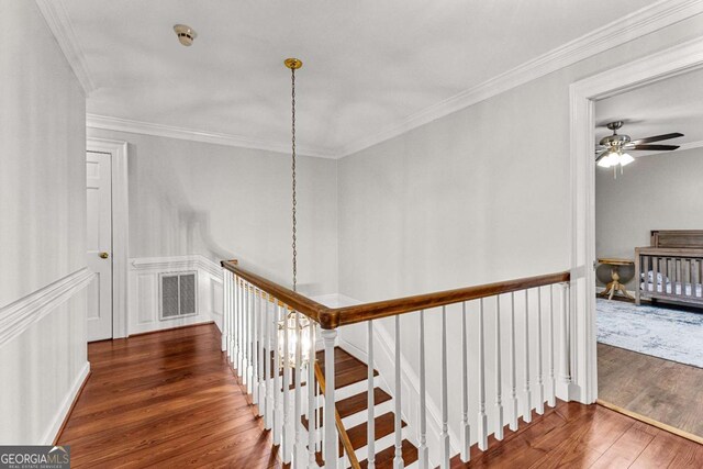 135 Mill Race Rd, Thomaston, GA 30286 - stairway with wood finished floors, ornamental molding, and a ceiling fan