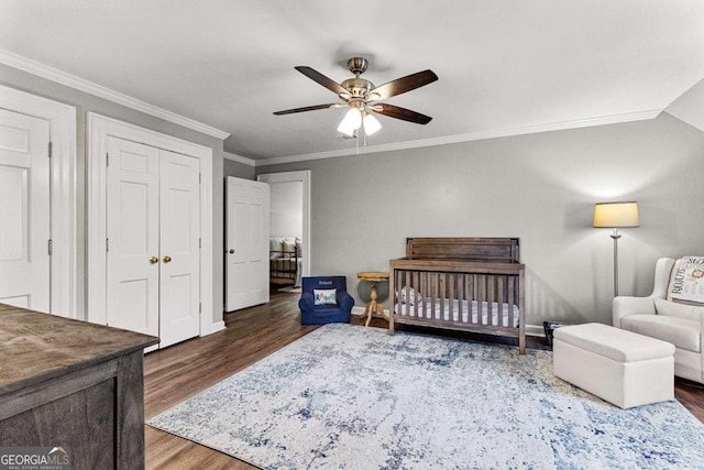 135 Mill Race Rd, Thomaston, GA 30286 - bedroom with wood finished floors, ornamental molding, baseboards, a ceiling fan, and a closet