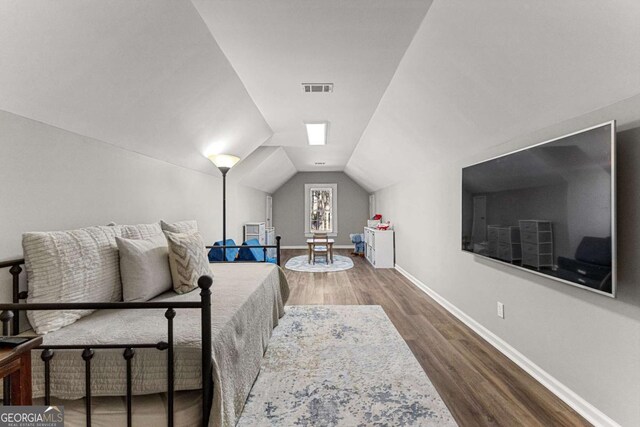 135 Mill Race Rd, Thomaston, GA 30286 - bedroom featuring wood finished floors, baseboards, and lofted ceiling