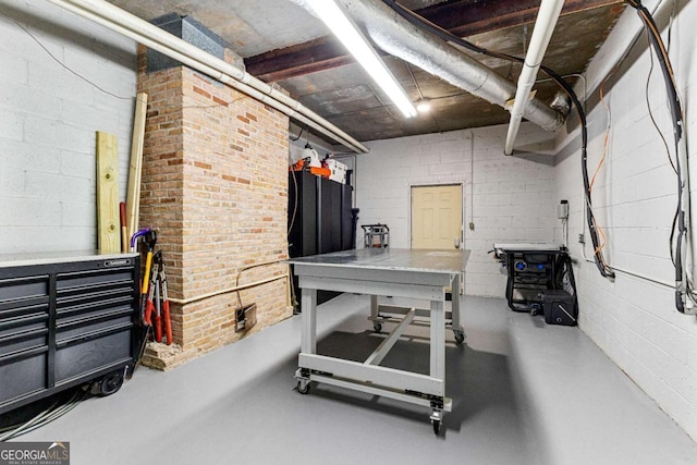 135 Mill Race Rd, Thomaston, GA 30286 - unfinished basement featuring concrete block wall and a workshop area