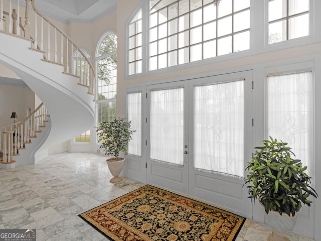 474 N Rover Rd, Williamson, GA 30292 - foyer entrance featuring a towering ceiling, stairs, plenty of natural light, arched walkways, and french doors