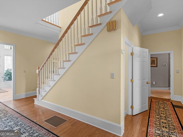 474 N Rover Rd, Williamson, GA 30292 - stairs featuring crown molding, wood finished floors, baseboards, and recessed lighting