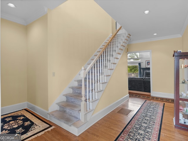 474 N Rover Rd, Williamson, GA 30292 - stairway with crown molding, wood finished floors, baseboards, and recessed lighting
