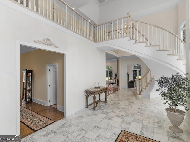 474 N Rover Rd, Williamson, GA 30292 - entrance foyer with a high ceiling, stairs, arched walkways, and baseboards