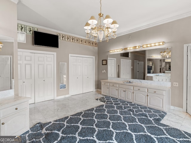 474 N Rover Rd, Williamson, GA 30292 - bathroom featuring a chandelier, marble look tiles, crown molding, and a closet
