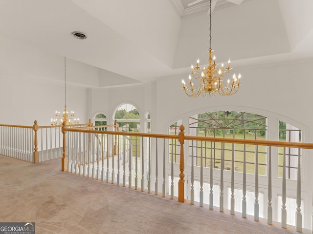 474 N Rover Rd, Williamson, GA 30292 - hallway with a chandelier, carpet, ornamental molding, a towering ceiling, and a tray ceiling