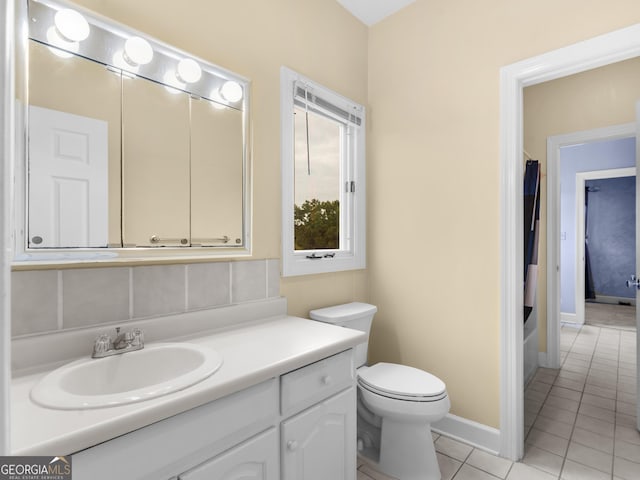 474 N Rover Rd, Williamson, GA 30292 - bathroom featuring tile patterned flooring, vanity, toilet, baseboards, and tasteful backsplash