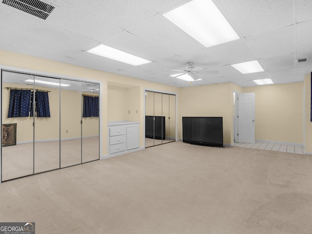 474 N Rover Rd, Williamson, GA 30292 - basement with light carpet, ceiling fan, a drop ceiling, and baseboards