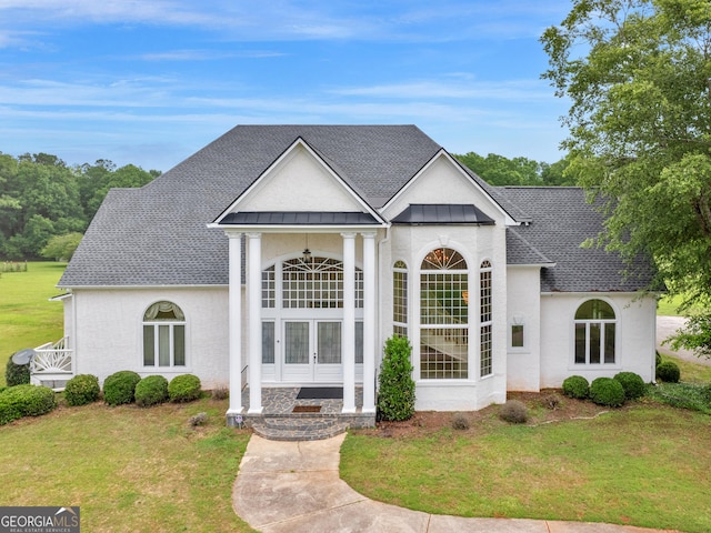 474 N Rover Rd, Williamson, GA 30292 - view of front of house featuring french doors, a standing seam roof, a front lawn, and metal roof