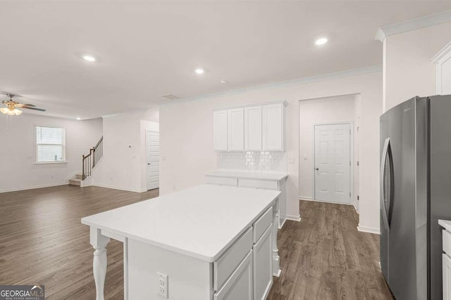 1159 Blue Juniper Cir, Loganville, GA 30052 - kitchen with freestanding refrigerator, a ceiling fan, dark wood finished floors, open floor plan, and recessed lighting
