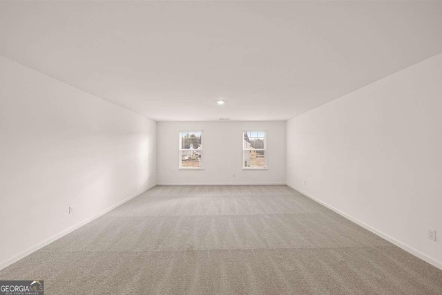 1159 Blue Juniper Cir, Loganville, GA 30052 - spare room with light carpet and baseboards