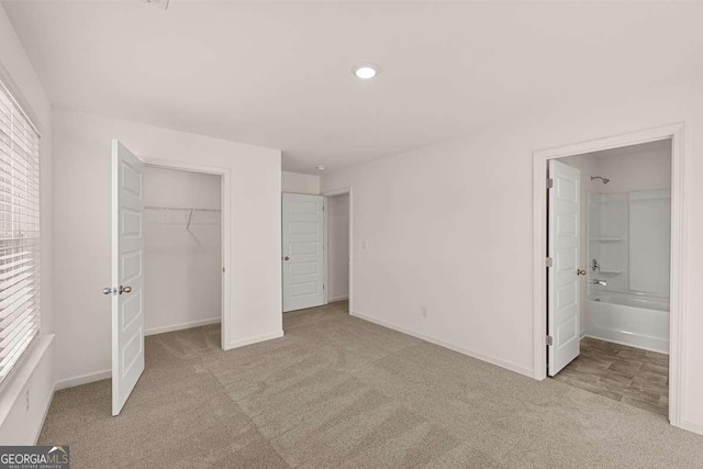 1159 Blue Juniper Cir, Loganville, GA 30052 - unfurnished bedroom featuring carpet flooring, baseboards, a closet, a walk in closet, and recessed lighting