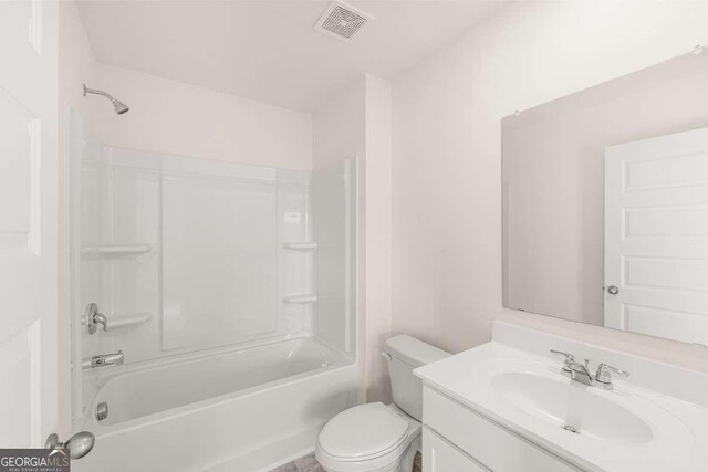 1159 Blue Juniper Cir, Loganville, GA 30052 - bathroom with vanity, toilet, and shower / tub combination