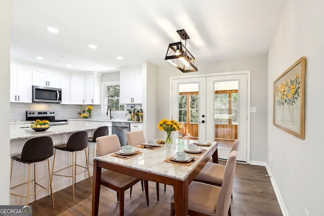 1483 Madison Rd, Monticello, GA 31064 - dining space with french doors, baseboards, dark wood-style flooring, and recessed lighting