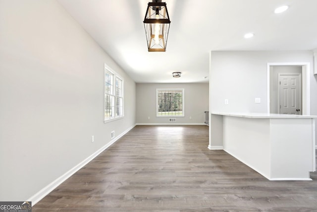 1483 Madison Rd, Monticello, GA 31064 - unfurnished living room with recessed lighting, wood finished floors, and baseboards