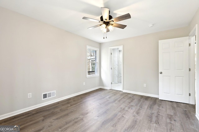 1483 Madison Rd, Monticello, GA 31064 - unfurnished bedroom featuring wood finished floors, baseboards, and a ceiling fan