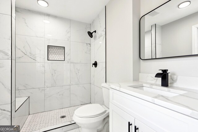 1483 Madison Rd, Monticello, GA 31064 - bathroom featuring vanity, toilet, recessed lighting, a marble finish shower, and marble look tiles