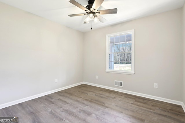1483 Madison Rd, Monticello, GA 31064 - empty room featuring baseboards, wood finished floors, and ceiling fan