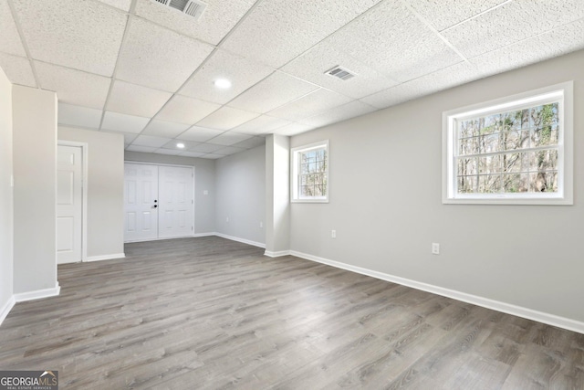 1483 Madison Rd, Monticello, GA 31064 - below grade area featuring wood finished floors, baseboards, and a paneled ceiling