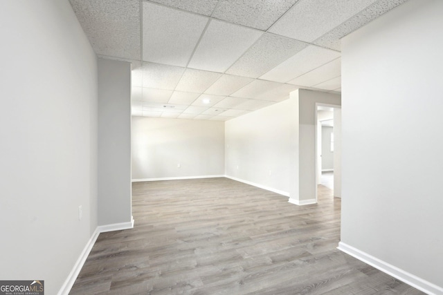 1483 Madison Rd, Monticello, GA 31064 - spare room featuring wood finished floors, a paneled ceiling, and baseboards