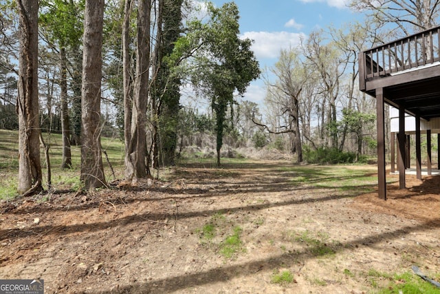 1483 Madison Rd, Monticello, GA 31064 - view of yard featuring a deck