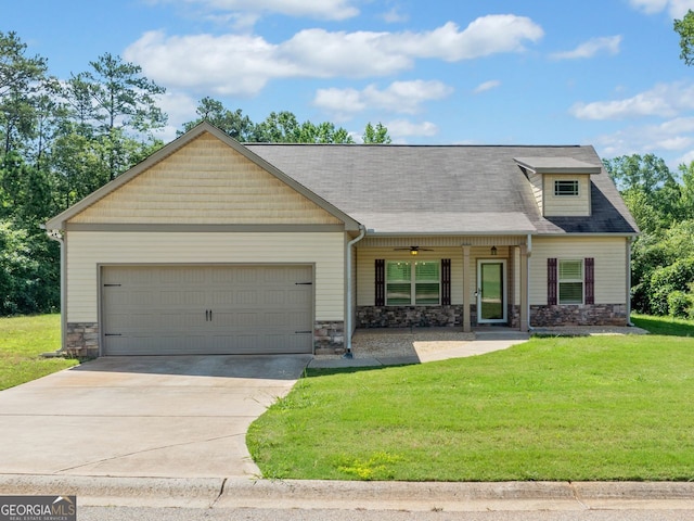 1010 Holliday Pass, Griffin, GA 30223 - craftsman-style house featuring stone siding, a garage, a front lawn, concrete driveway, and covered porch