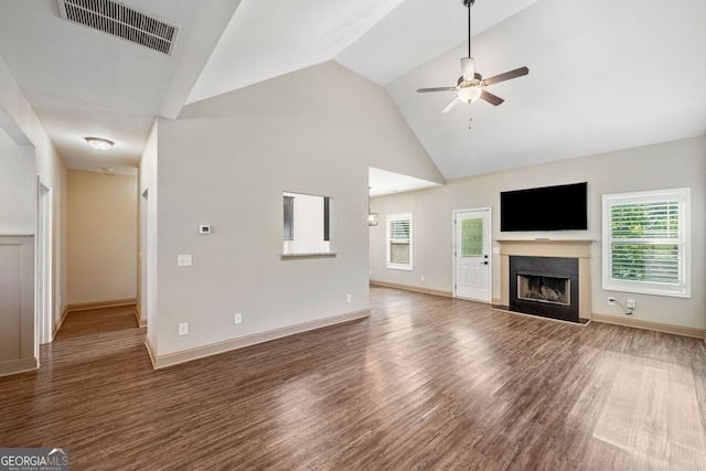 1010 Holliday Pass, Griffin, GA 30223 - unfurnished living room featuring a ceiling fan, wood finished floors, a fireplace, and high vaulted ceiling