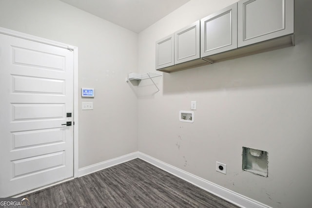 1010 Holliday Pass, Griffin, GA 30223 - laundry room featuring hookup for a washing machine, dark wood-type flooring, cabinet space, and electric dryer hookup