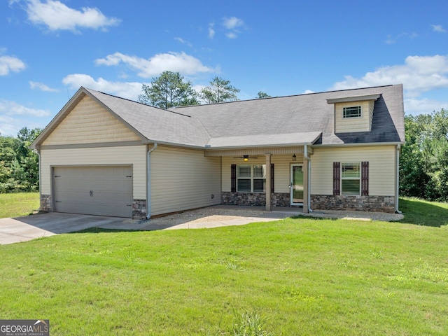 1010 Holliday Pass, Griffin, GA 30223 - view of front of property featuring stone siding, a garage, a front yard, driveway, and ceiling fan