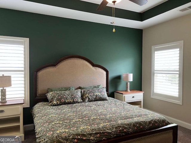 1010 Holliday Pass, Griffin, GA 30223 - carpeted bedroom featuring multiple windows and baseboards