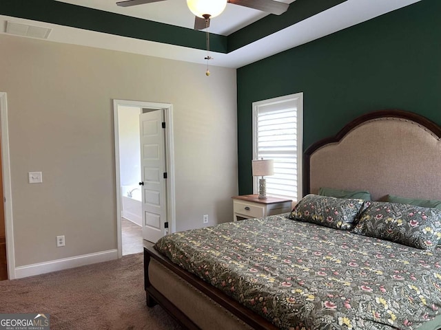1010 Holliday Pass, Griffin, GA 30223 - bedroom with carpet flooring, baseboards, and ensuite bath