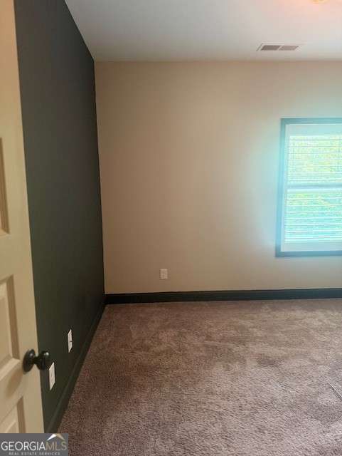 1010 Holliday Pass, Griffin, GA 30223 - unfurnished room with carpet floors and baseboards
