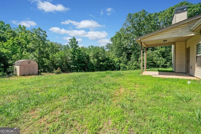 1010 Holliday Pass, Griffin, GA 30223 - view of grassy yard with a storage shed