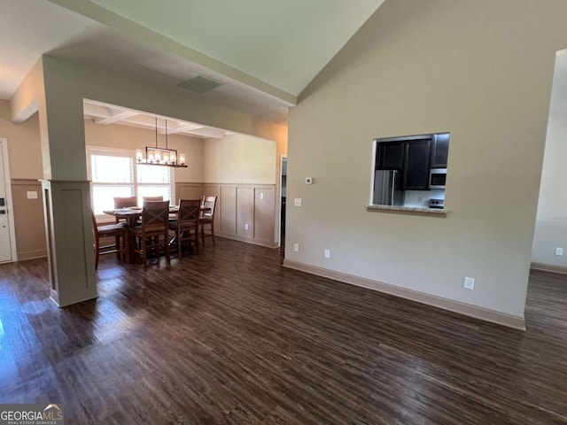 1010 Holliday Pass, Griffin, GA 30223 - dining area featuring dark wood-style floors, a chandelier, wainscoting, coffered ceiling, and beam ceiling