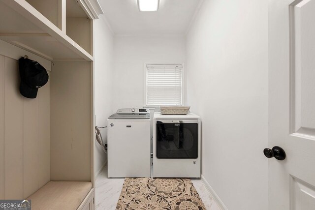 3714 Westbrooke Cir, Brookhaven, GA 30319 - laundry area with separate washer and dryer, ornamental molding, and light marble finish flooring