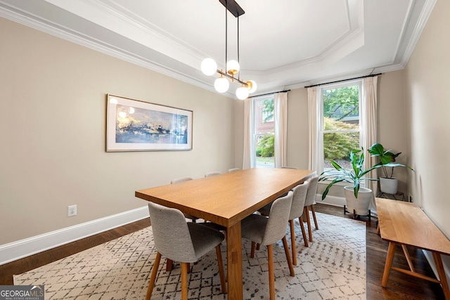 3714 Westbrooke Cir, Brookhaven, GA 30319 - dining room with crown molding, baseboards, dark wood finished floors, a tray ceiling, and a chandelier