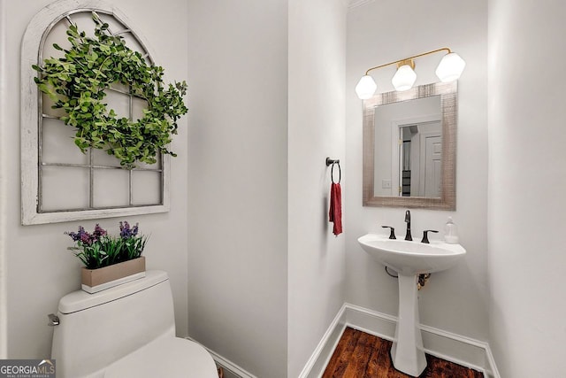 3714 Westbrooke Cir, Brookhaven, GA 30319 - half bathroom featuring baseboards, toilet, and wood finished floors