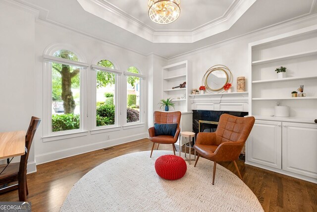 3714 Westbrooke Cir, Brookhaven, GA 30319 - sitting room featuring a premium fireplace, dark wood-style floors, ornamental molding, baseboards, and a raised ceiling