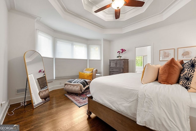 3714 Westbrooke Cir, Brookhaven, GA 30319 - bedroom with multiple windows, ornamental molding, wood finished floors, a tray ceiling, and ceiling fan