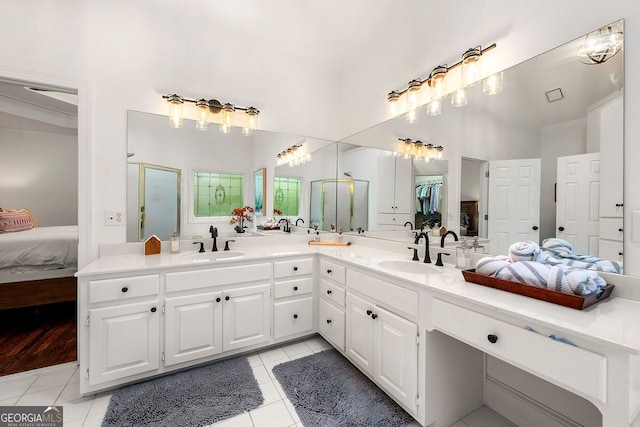 3714 Westbrooke Cir, Brookhaven, GA 30319 - full bathroom with tile patterned flooring, ensuite bath, double vanity, a stall shower, and a high ceiling